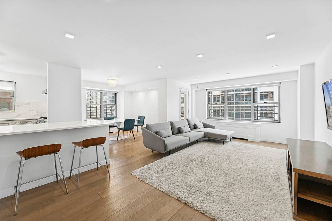 Beautifully renovated three bedroom, two bathroom residence with a private balcony and approximately 1, 534 interior square feet.