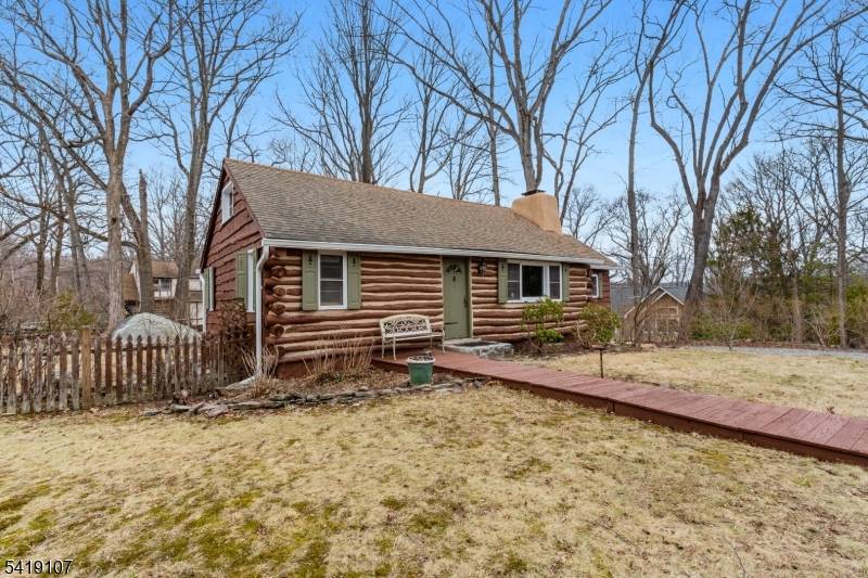 A rare blend of rustic charm and timeless character in the heart of sought after Fayson Lakes.