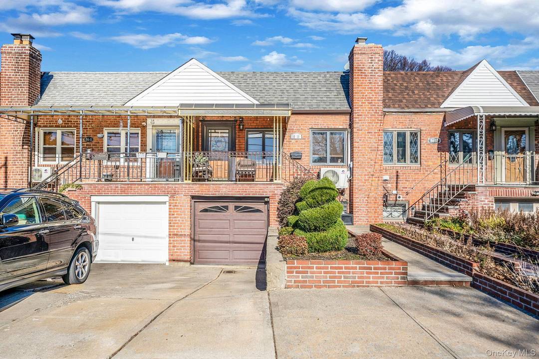 Welcome to 86 15 77th Avenue, a beautifully maintained brick residence ideally situated in the heart of Upper Glendale.