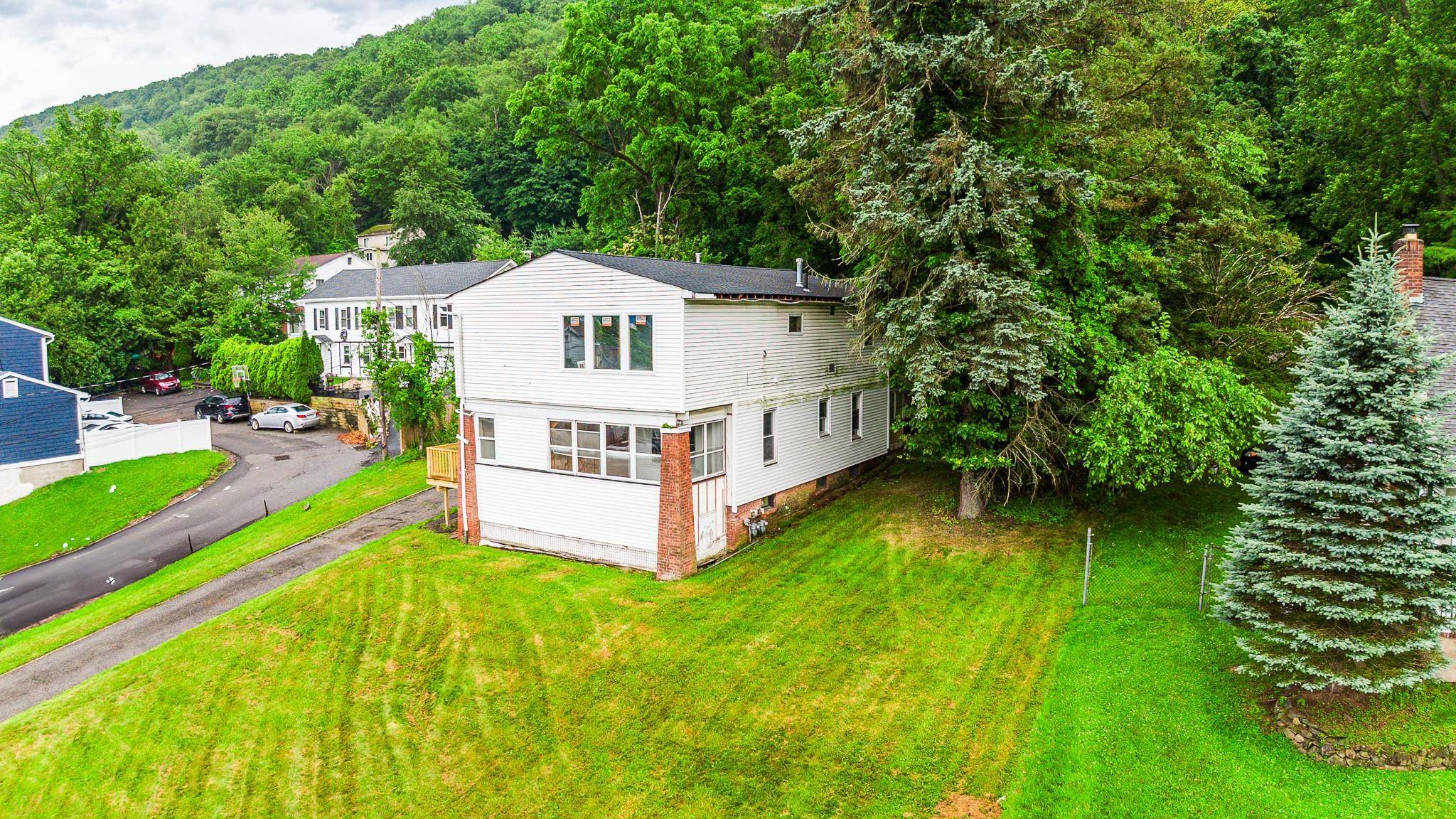 Investors step forward ! Amazing opportunity with this legal 2 family 3 Bedroom 1 Bath over a 2 Bedroom plus enclosed Porch 1 Bath.
