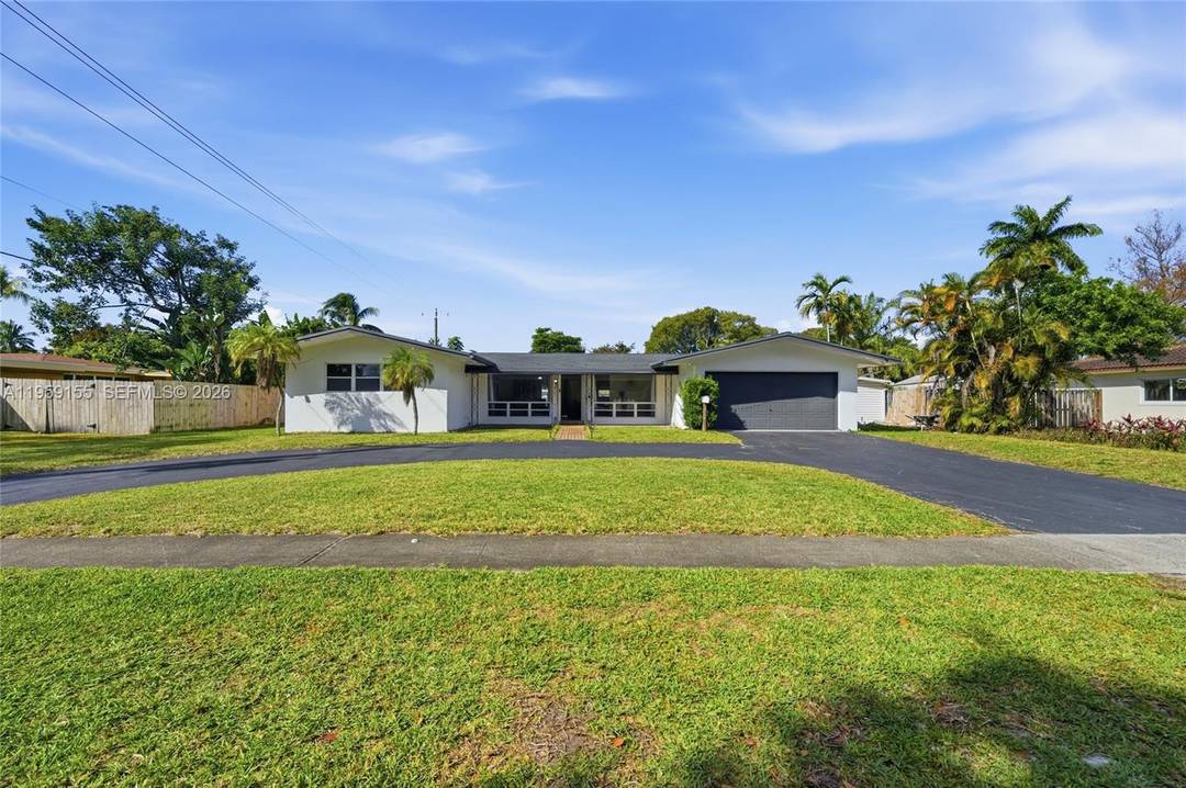 Beautifully Updated 3 Bedroom, 2 Bath Home With A 2 Car Garage Positioned On A Large Oversized Fenced Lot Located In The Heart Of Plantation.