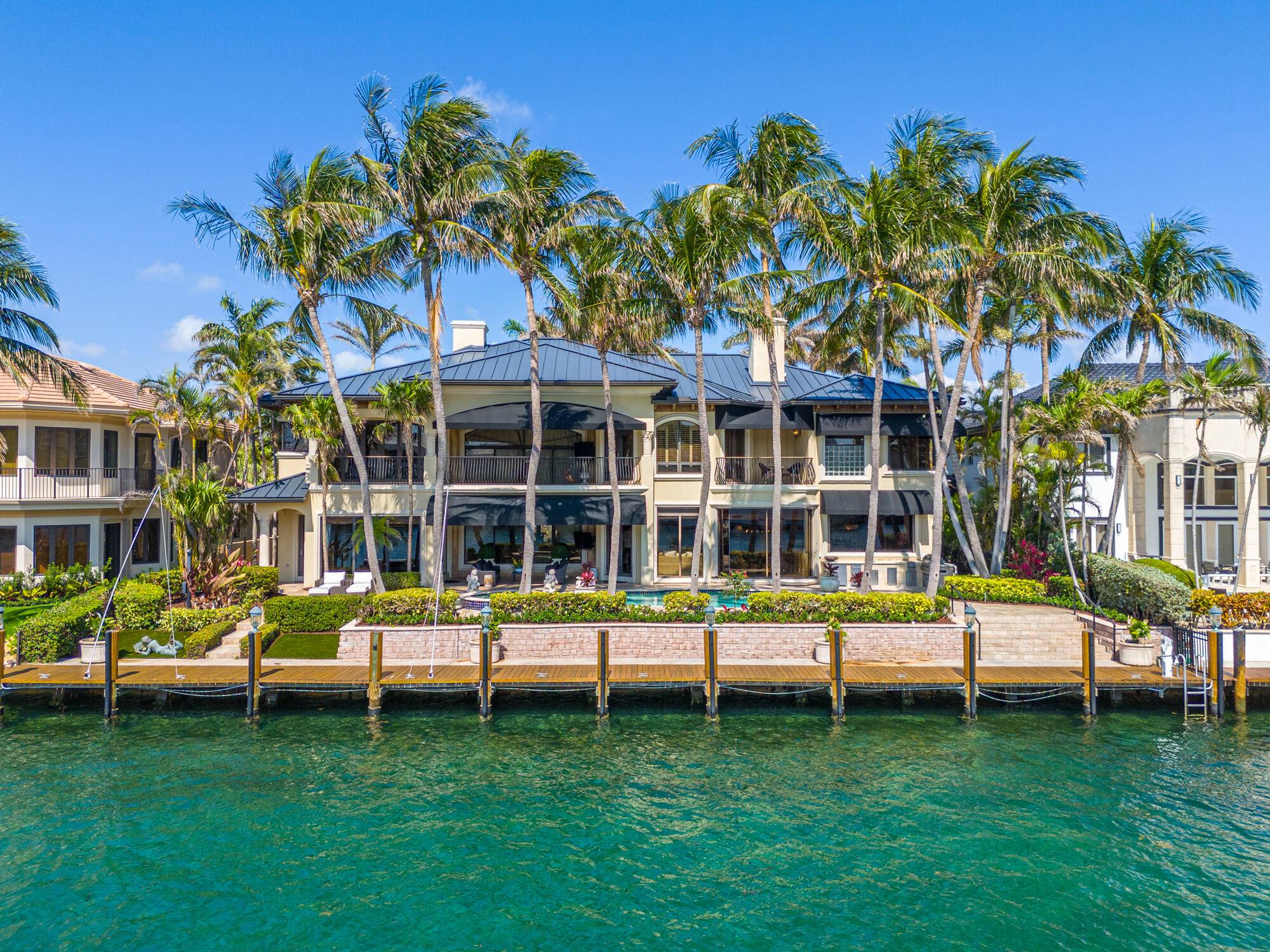 This exquisite and sophisticated Custom Estate home is a rare, prized property on the direct Intracoastal No Wake Zone with ample room to dock an 80' vessel, within minutes to ...