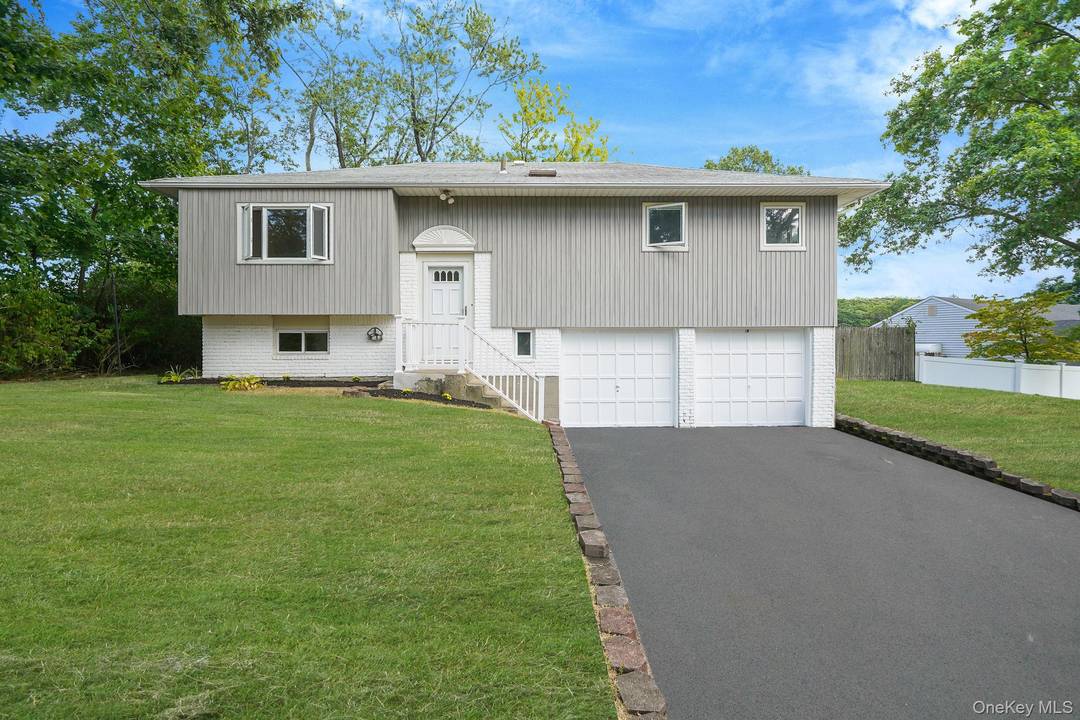 Welcome to this beautifully renovated high ranch tucked away on a quiet cul de sac in the heart of Smithtown.