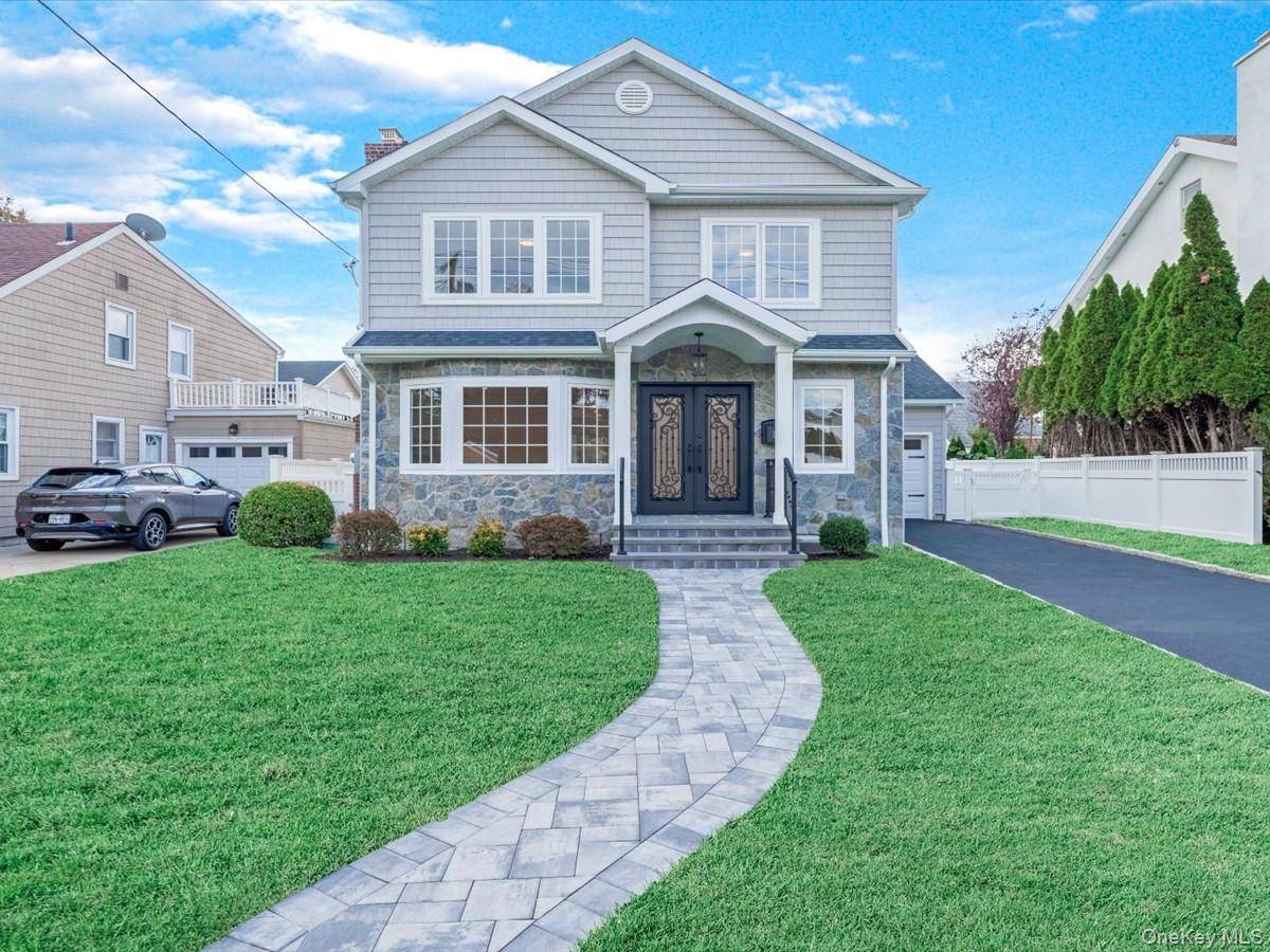 Welcome to this beautifully reimagined residence, perfectly situated on a quiet and desirable street in New Hyde Park.