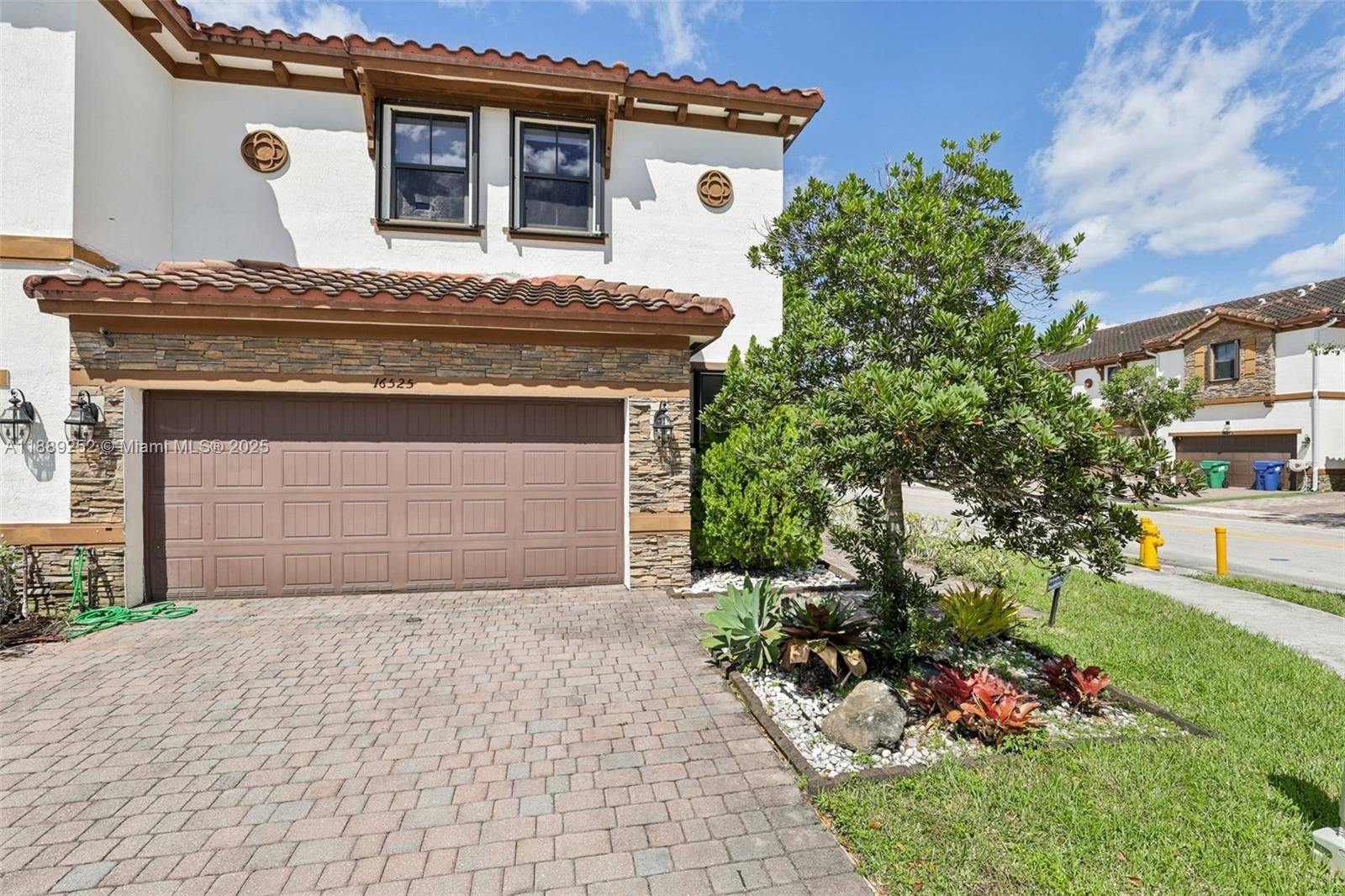 Corner lot lakefront gem in Towns at Grand Lakes Estates !