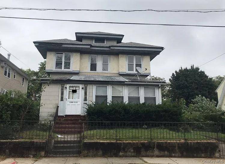 Nestled in a prime area, this beautiful two family house offers an exceptional living experience with its spacious layout and modern amenities.