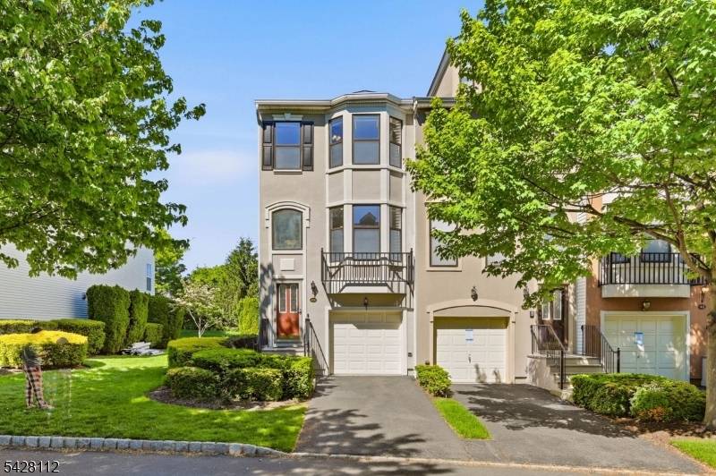 This stunning tri level end unit townhome offers an exceptional blend of modern design and thoughtful renovations throughout.
