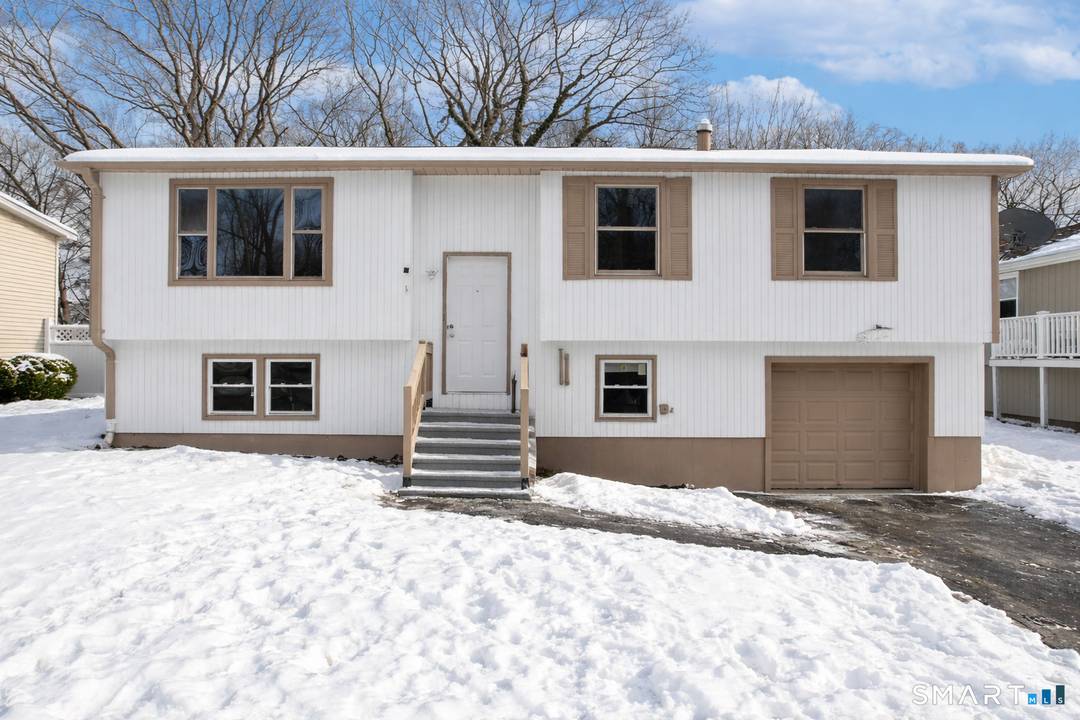 Come home to an updated West Haven raised ranch where the layout works, the finishes feel fresh, and the shoreline is close enough to enjoy on your schedule.