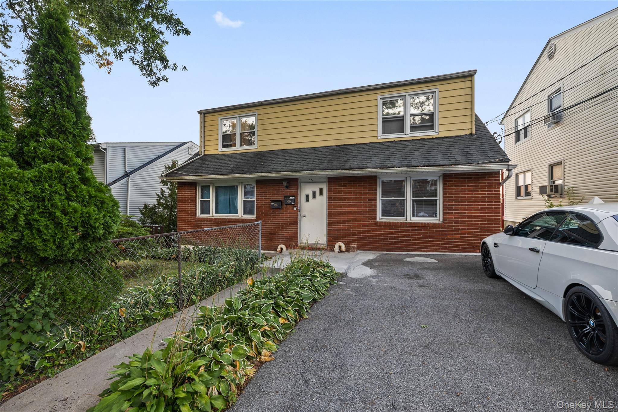 Welcome to this well maintained two family duplex, ideal for both homeowners and investors.