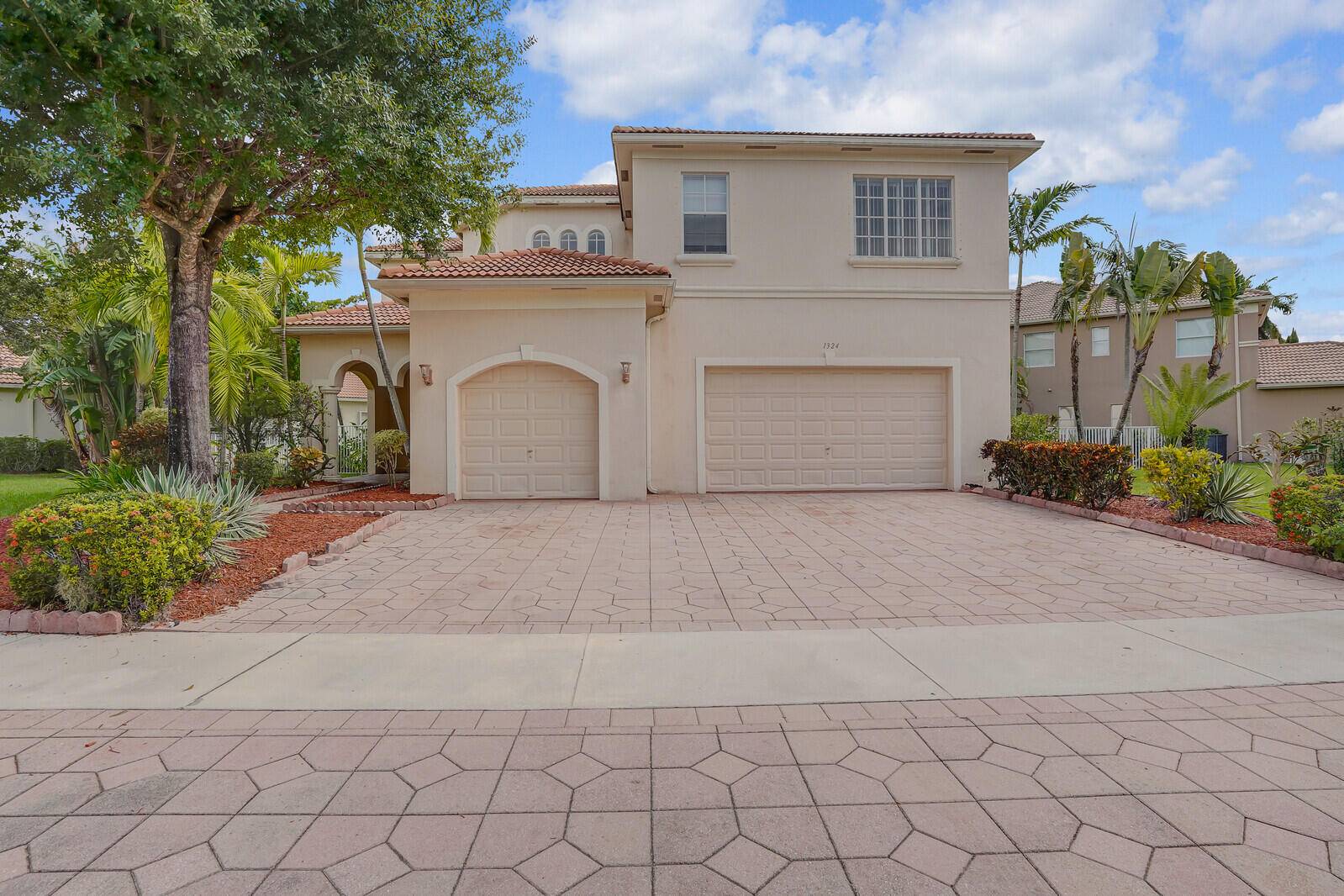 Discover this spacious and beautifully designed 5 bedroom, 4 bathroom Mediterranean style home with a private pool located in the sought after gated community of Black Diamond in Wellington.