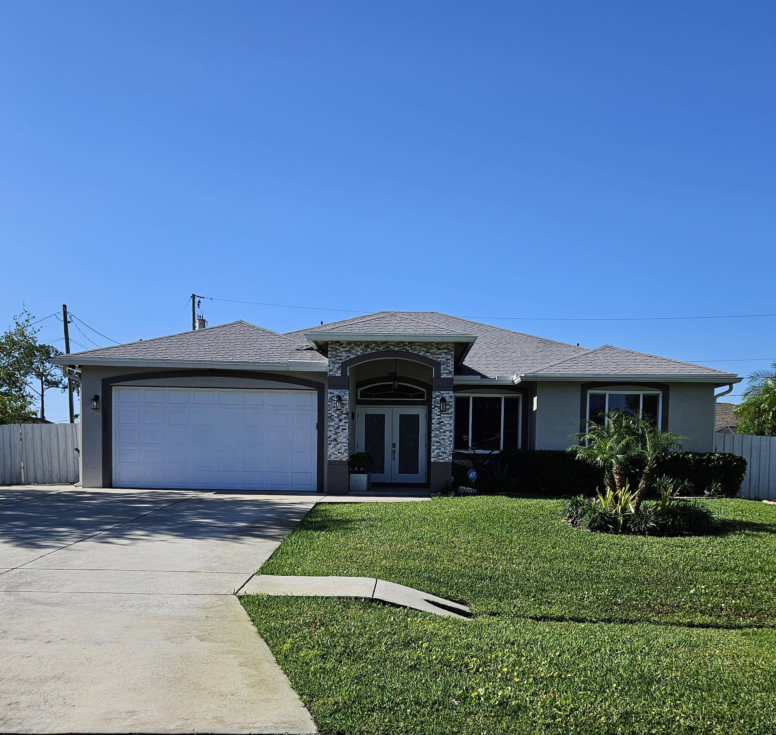 Tropical resort style pool home situated on a quiet street near Tradition.