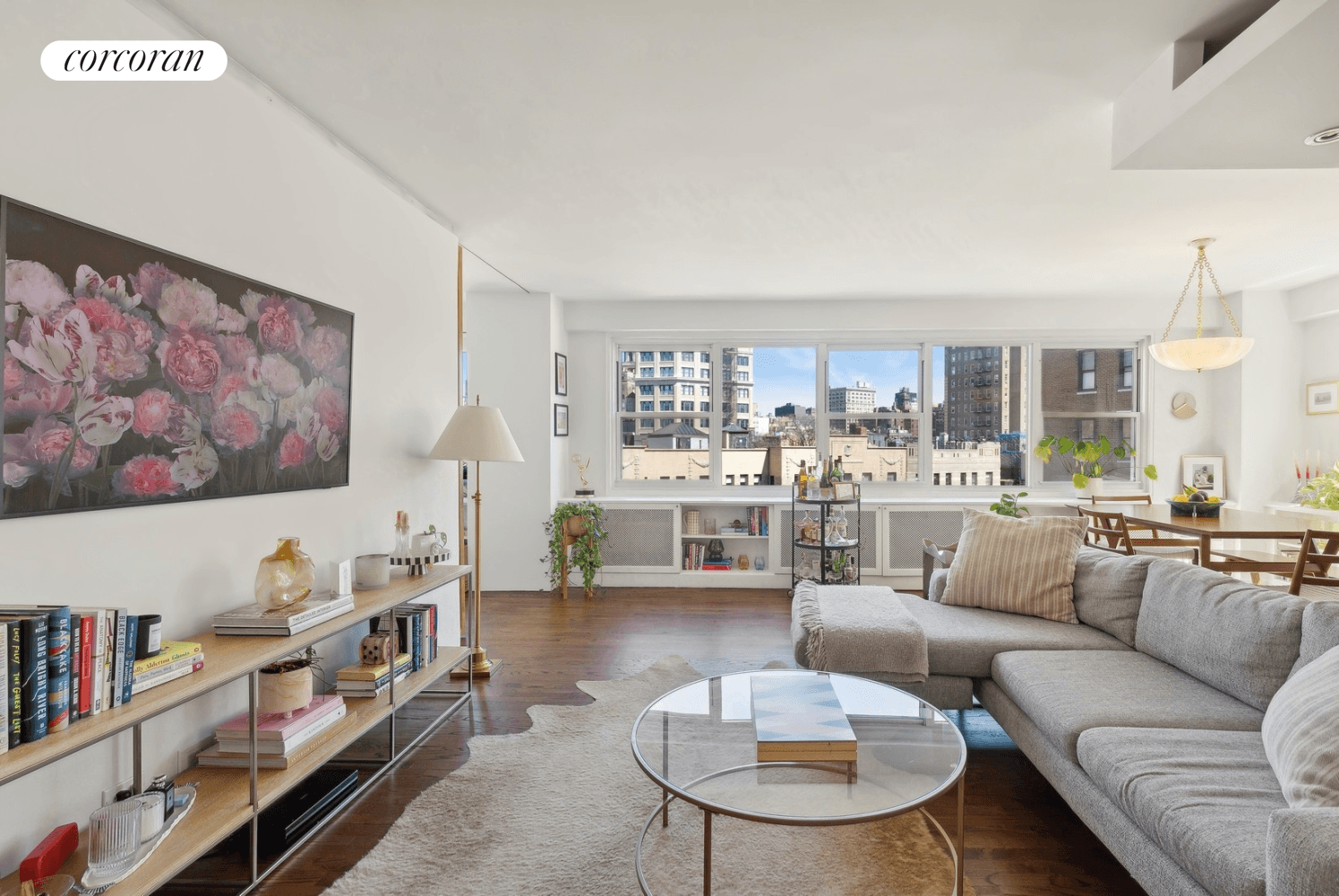 This triple mint apartment boasts breathtaking views of the city skyline and an abundance of natural sunlight that floods the space.