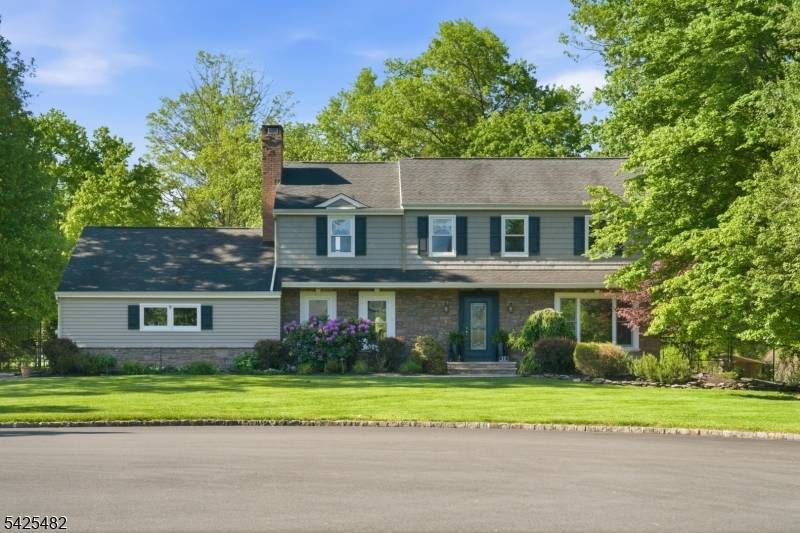 Welcome to 11 Barbara Drive, a Center Hall Colonial set on nearly 1 acre on a quiet cul de sac in the sought after Woods Road School neighborhood.