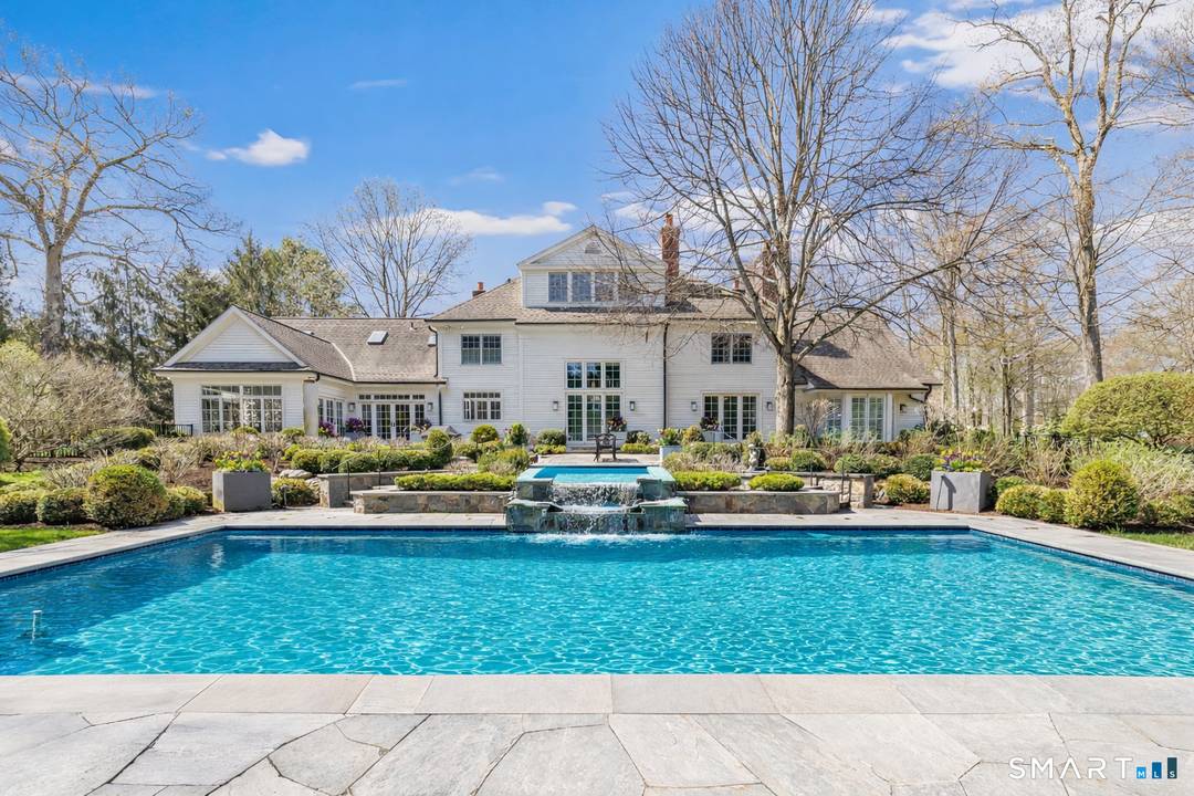 Tucked away on a quiet cul de sac in the heart of Greenfield Hill, this exceptional 7, 100 sqft estate is set on two meticulously landscaped acres, offering a rare ...
