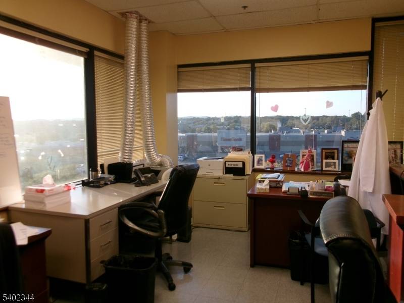 This bright 4th floor corner 17 Room medical office suite has 2 waiting Rooms, 8 exam rooms, Kitchen, 3 private offices, 2 storage rooms and Lab room.