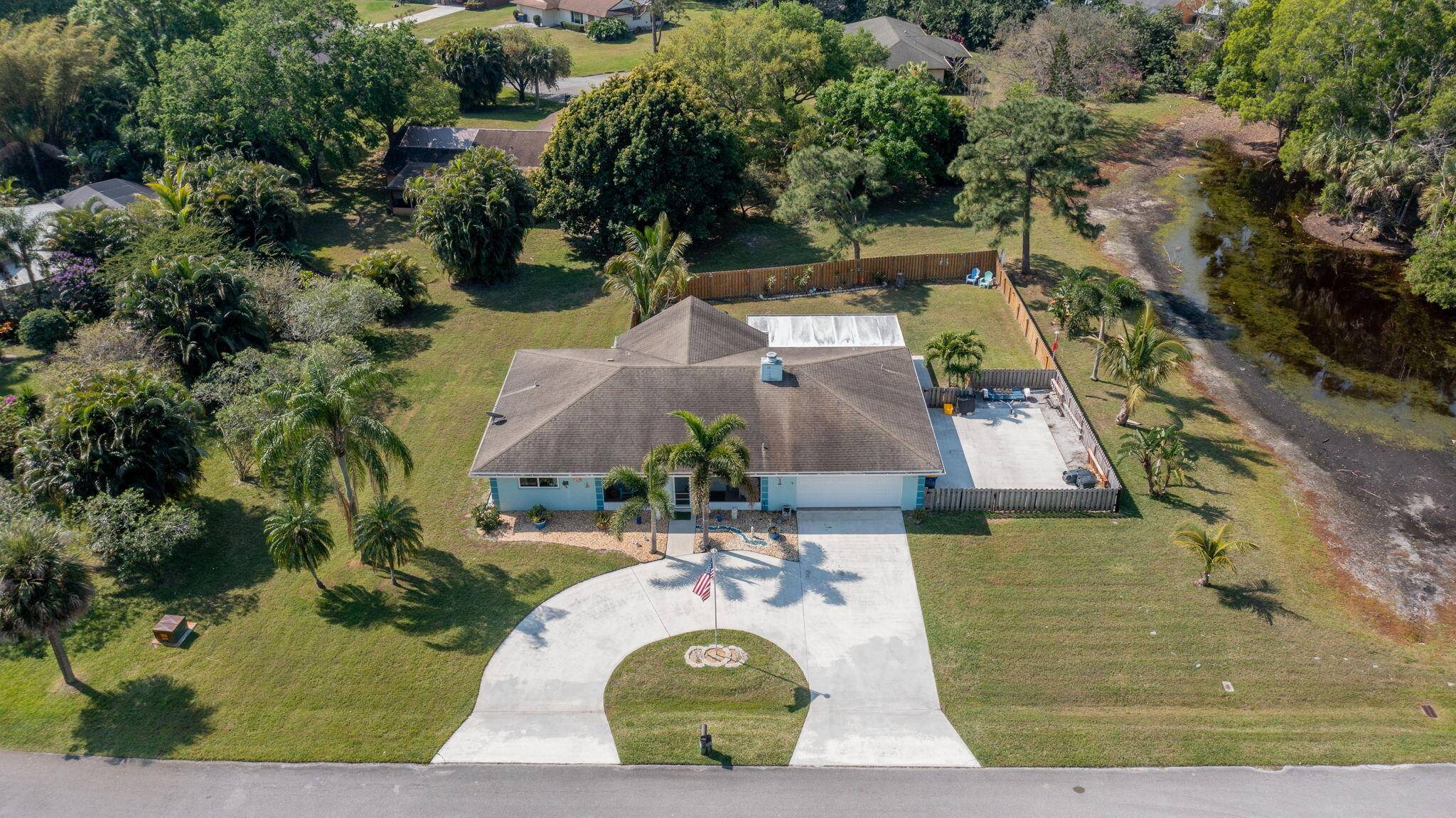 Come enjoy the Peace Serinity of this half 1 2 acre Fabulous Home w Beachy Vibe !