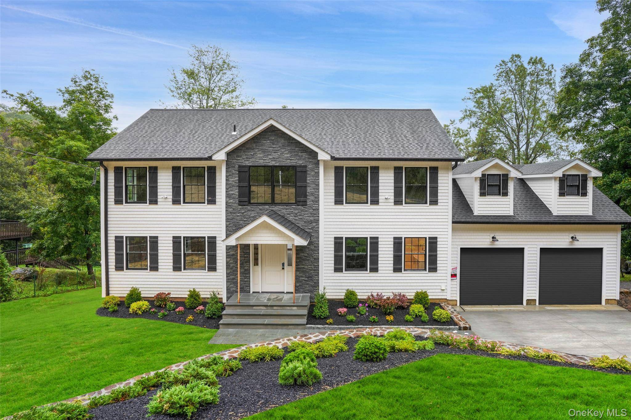 Brand new custom Center Hall Colonial blending modern design with timeless style.