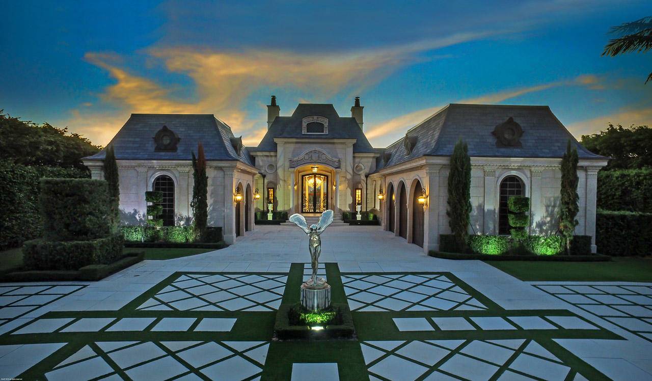 Modern elegance meets traditional style throughout in this stunning French Chateau inspired waterfront home in the prestigious Admiral Cove.