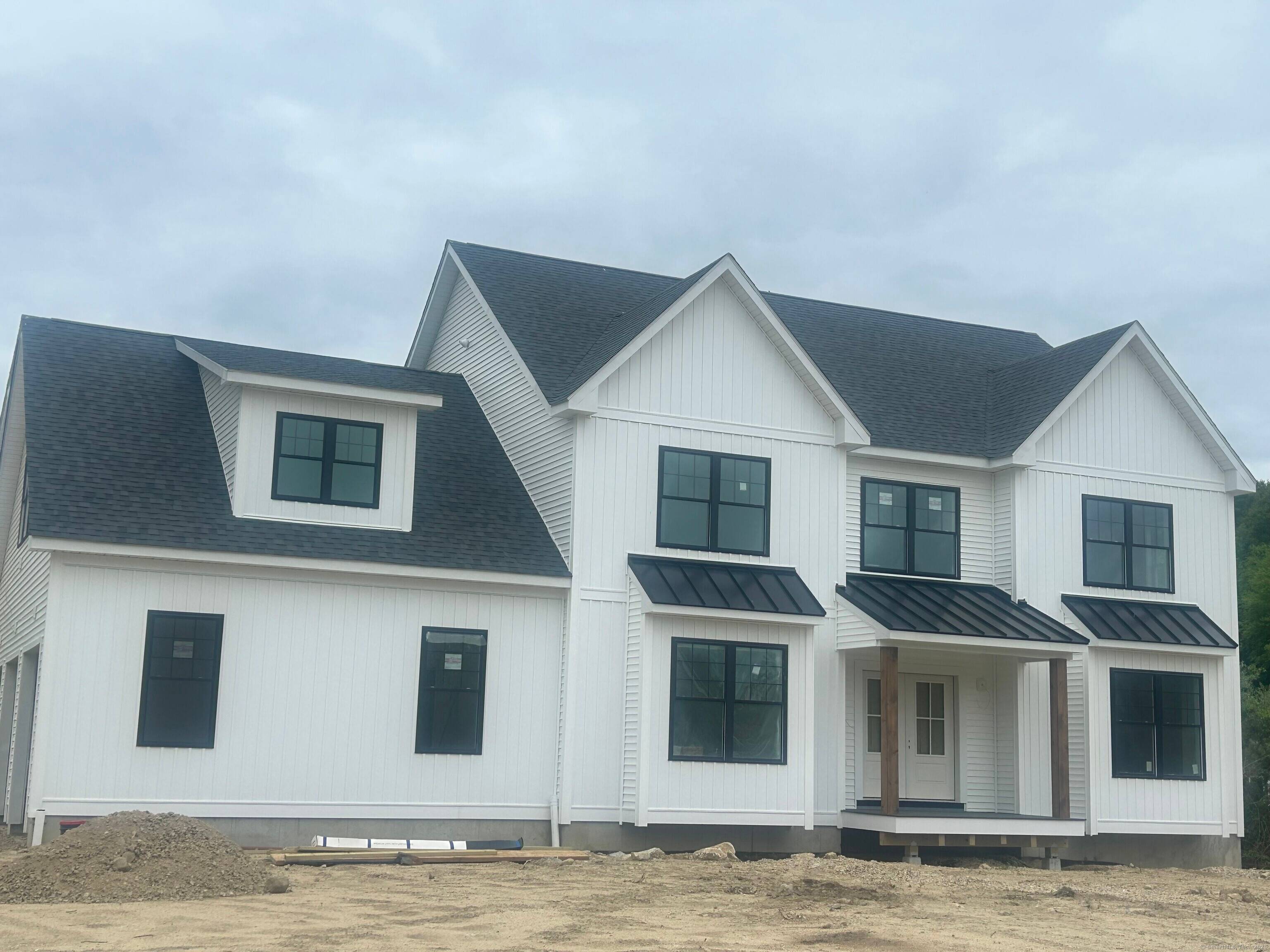 Nestled in a picturesque East Lyme subdivision, this new construction home showcases exceptional craftsmanship and thoughtful detail in every room.