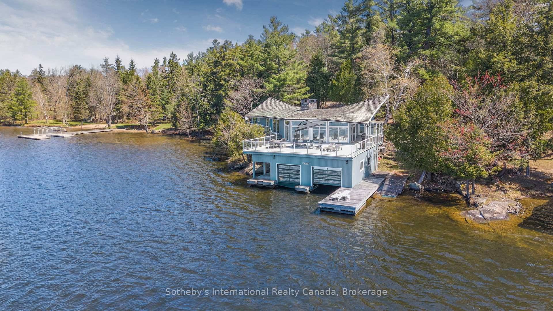 Arrive at your private, tree lined driveway and enter refined lakeside living on iconic Lake Rosseau.