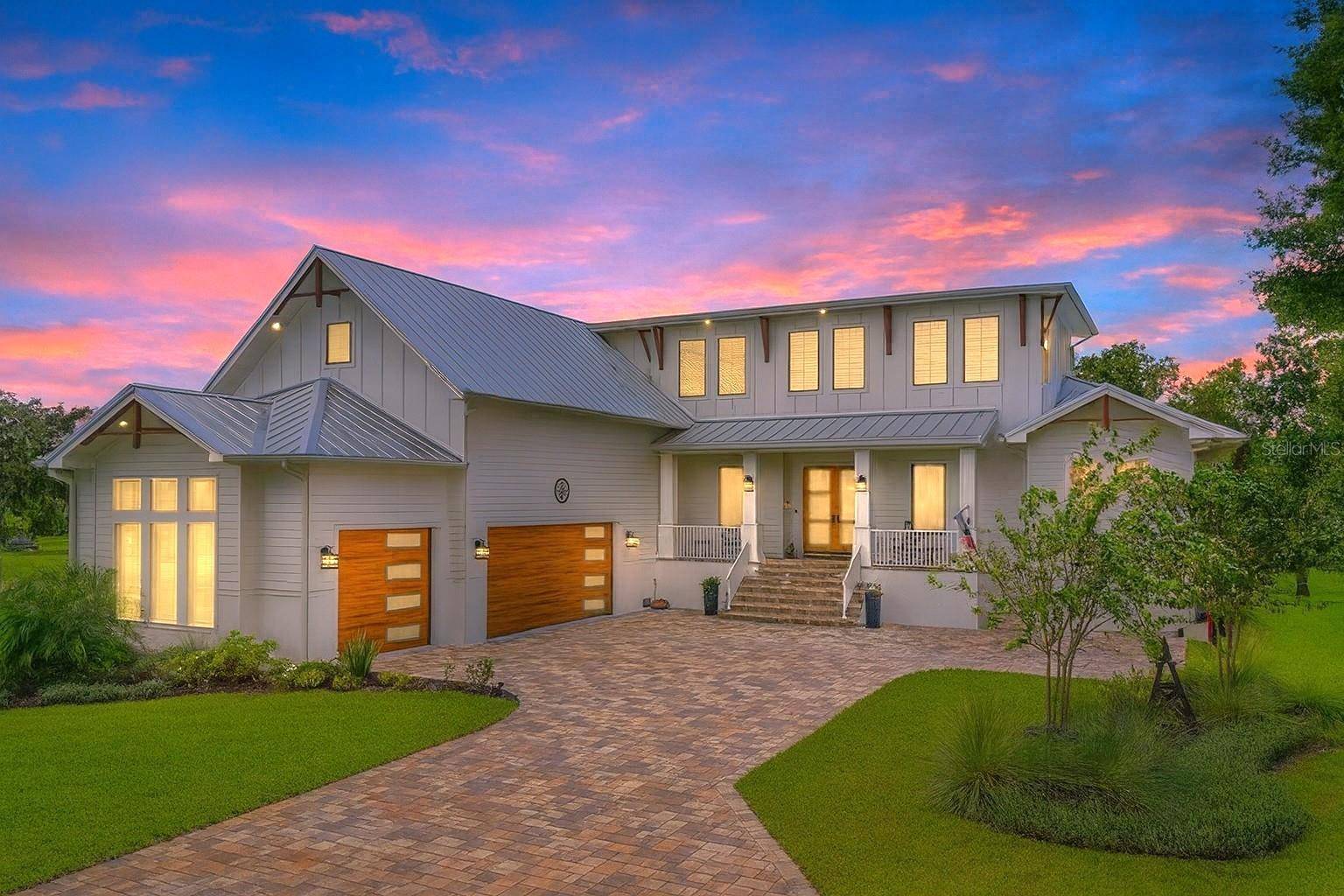 Modern riverfront living with this brand new Belvedere custom home, completed in 2024 and set on a generous.