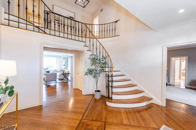 An elegant Upper Montclair custom home offering refined living and exceptional scale, set on a lushly landscaped three quarter acre property designed for both grand entertaining and everyday comfort.