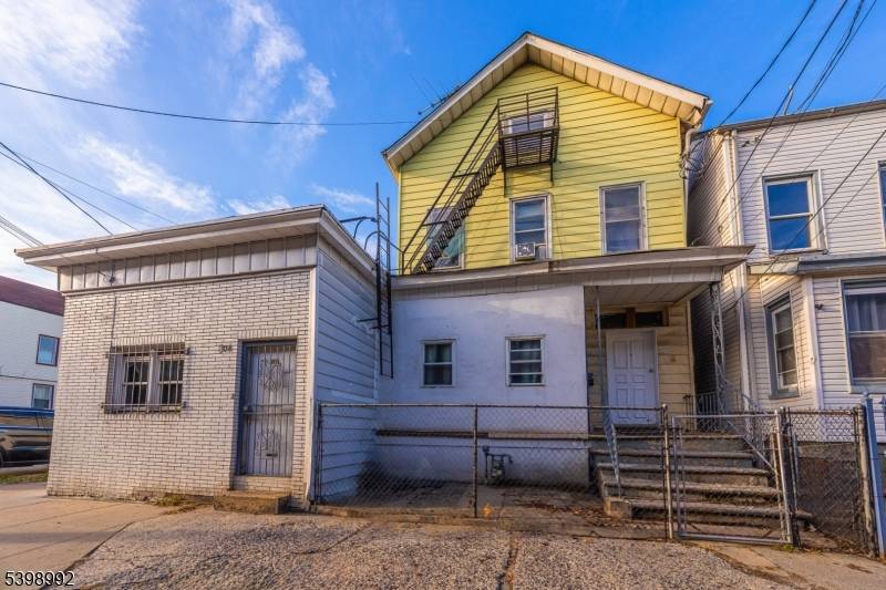 4 family property in Elizabeth, NJ featuring 7 on site parking spaces.