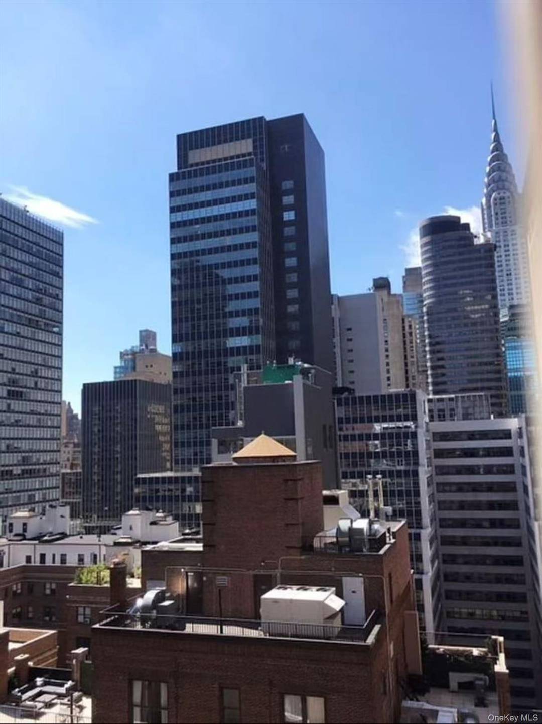 Residence 22C is south facing large one bedroom with bay windows.