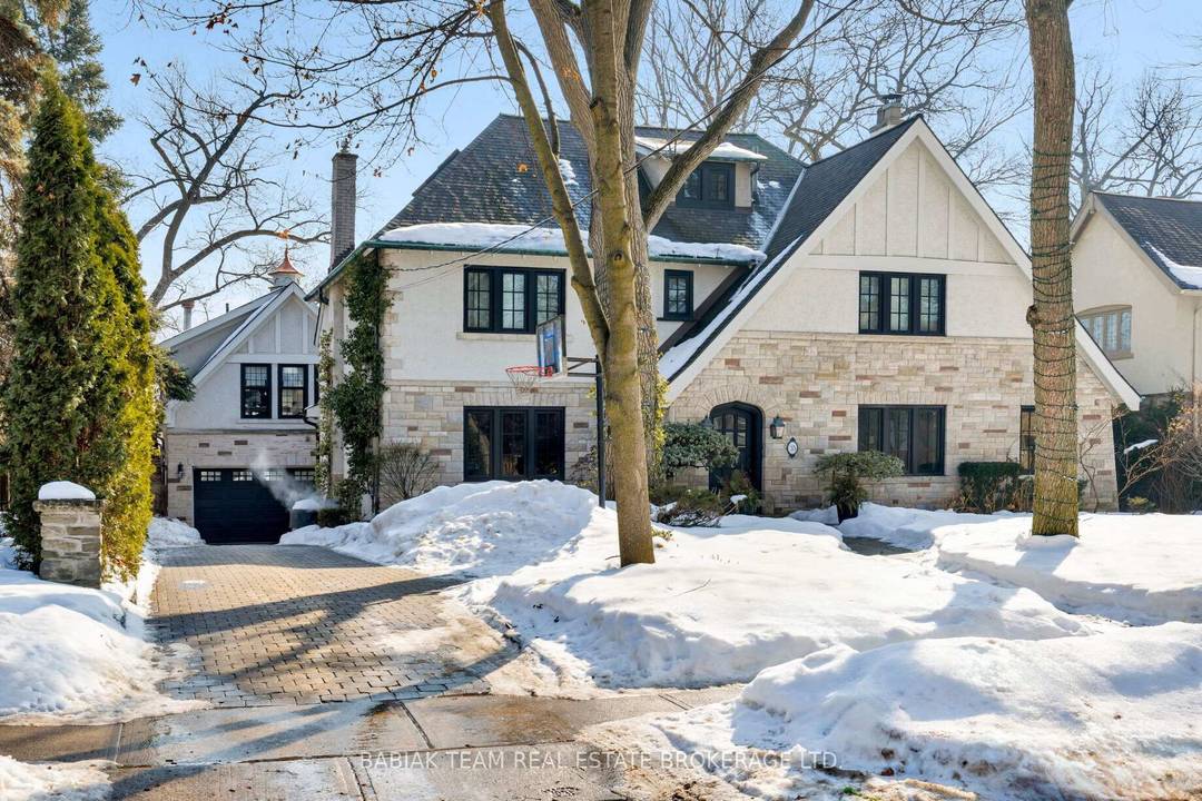 Majestic 6 1 bedroom residence, set on a spectacular 75' x 190' Muskoka like ravine lot in the heart of prestigious Baby Point !