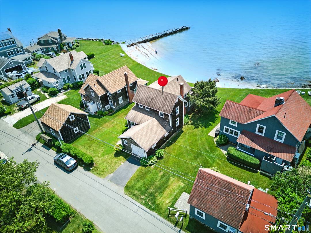 Spectacular Waterfront Home on Long Island Sound Step into a world of timeless elegance at this beautifully updated waterfront cottage, where classic New England charm meets modern comfort.