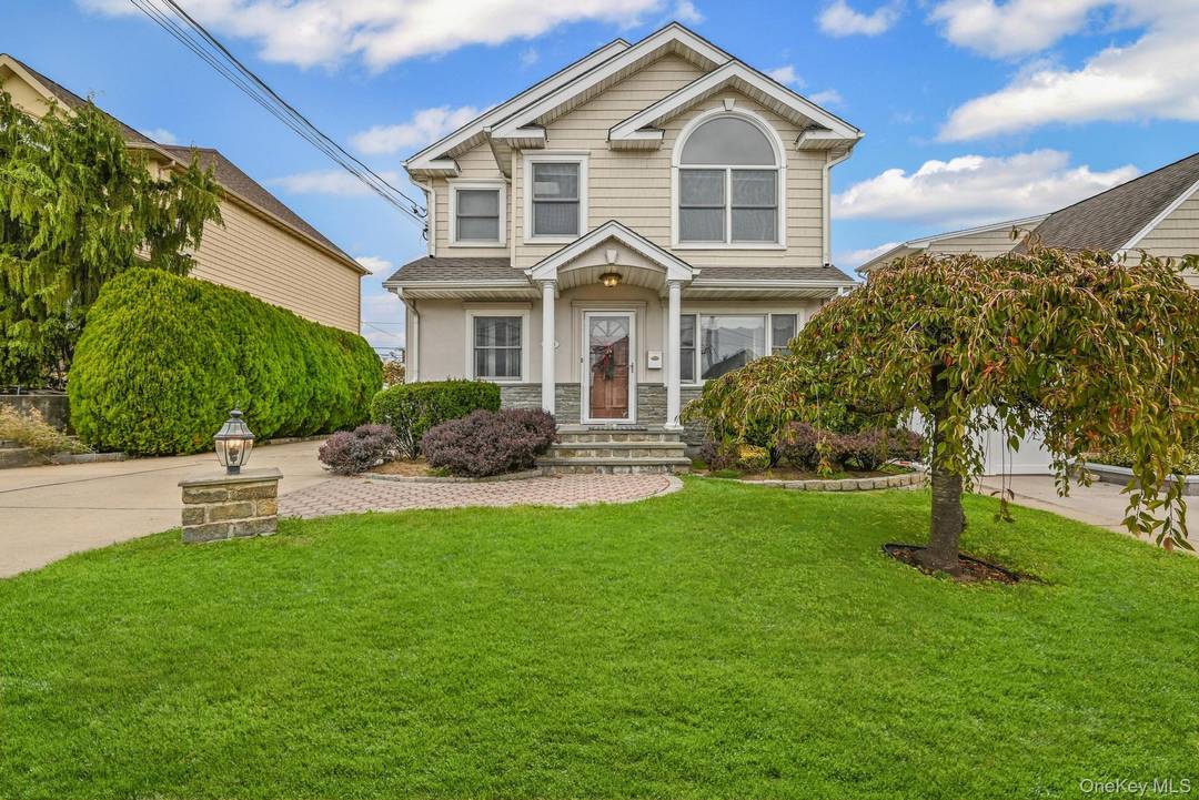 Move right into this bright and spacious Home with mother daughter permits tucked away on a quiet, dead end street in desirable Franklin Square !