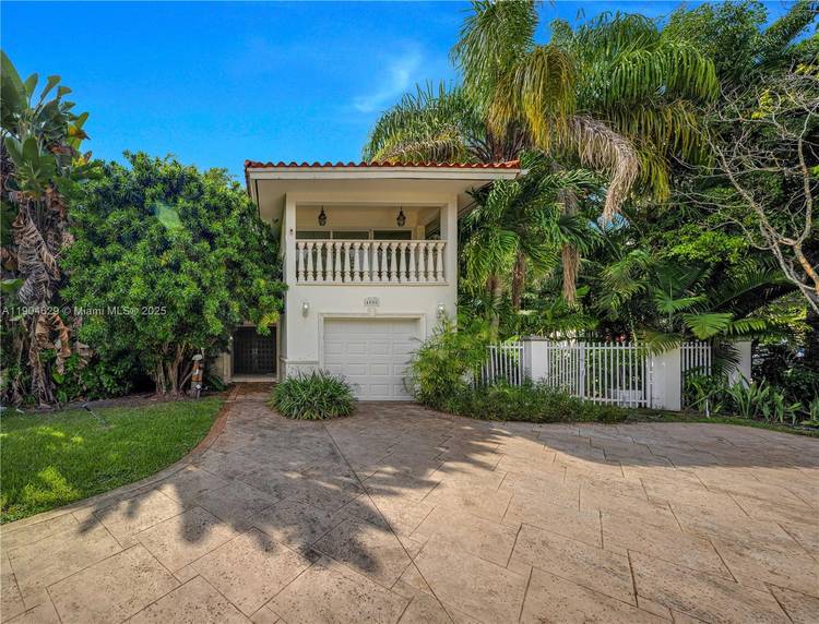 Bright amp ; spacious 2 story home on a desirable corner lot in the heart of Coral Gables, located on prestigious Alhambra Circle.