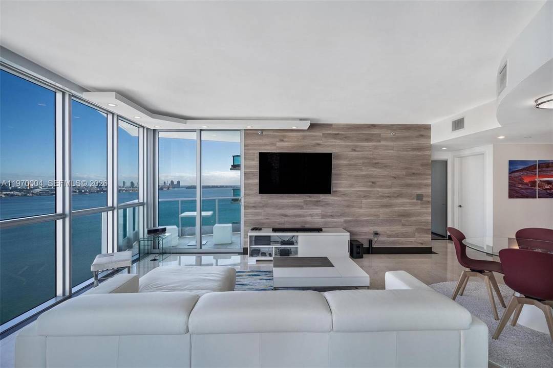 Experience elevated living in this exceptional corner residence at Jade at Brickell Bay.