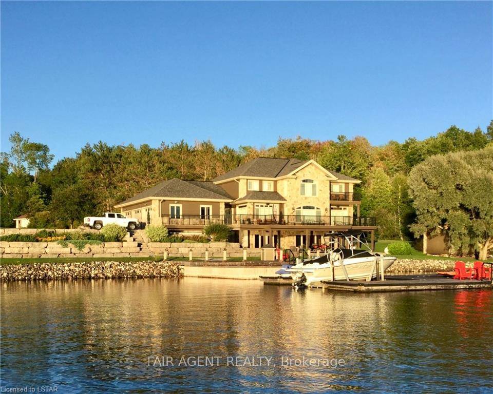 Located in the tranquil northern reaches of Ontario, this waterfront masterpiece in Port Loring offers approx 4, 000 square feet of thoughtfully designed living space on 1.