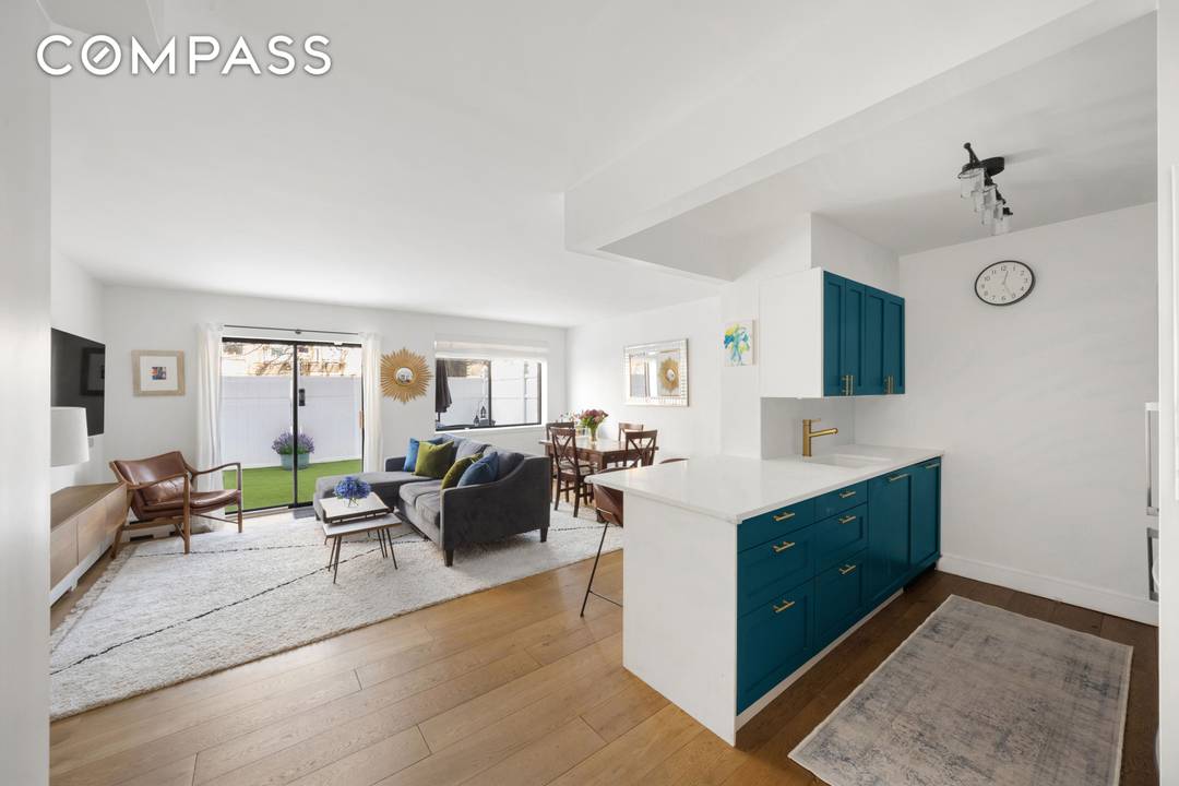 This stunning East Harlem 2 bedroom, 2 bathroom apartment is a standout, featuring designer finishes and an expansive, fenced back patio a rare find in this city.