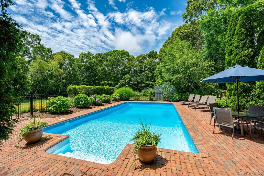 Explore the ultimate in privacy at 9 North Quarter Road, located down a long, hedge lined driveway in Westhampton.