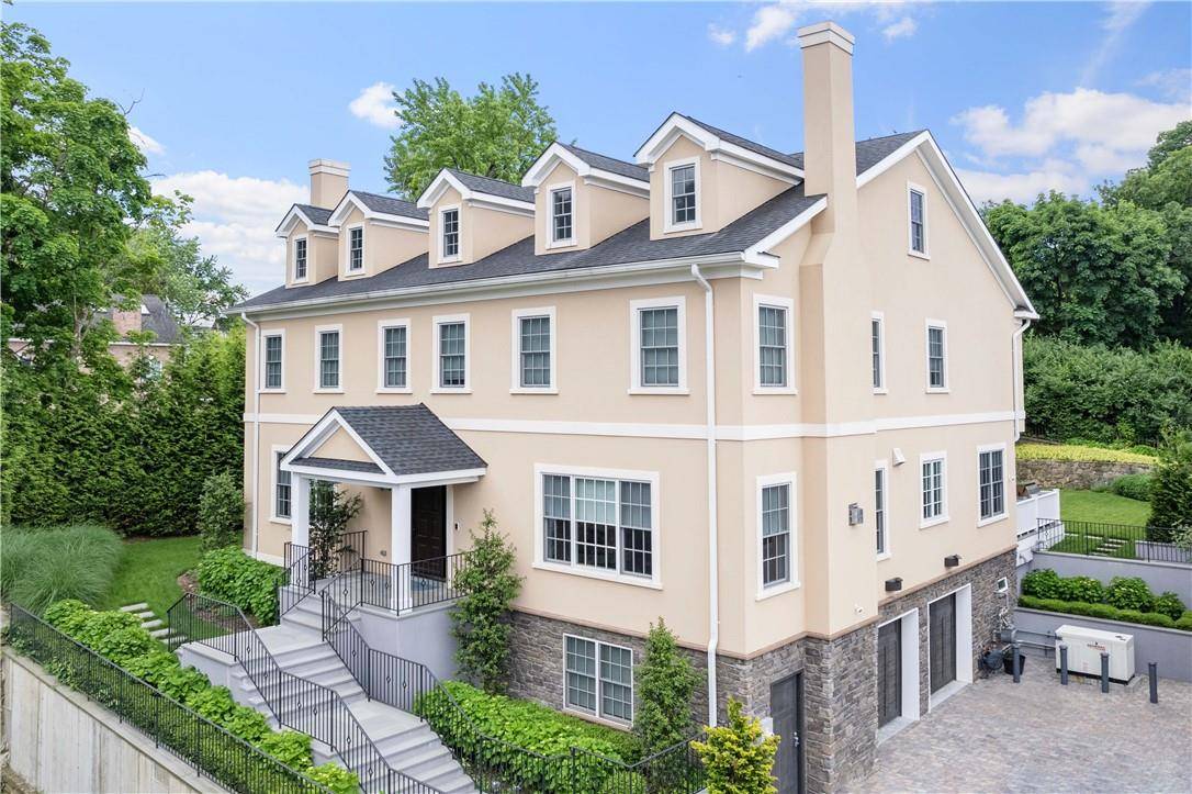 Modern elegance defines this stunning custom built home in Riverdale.