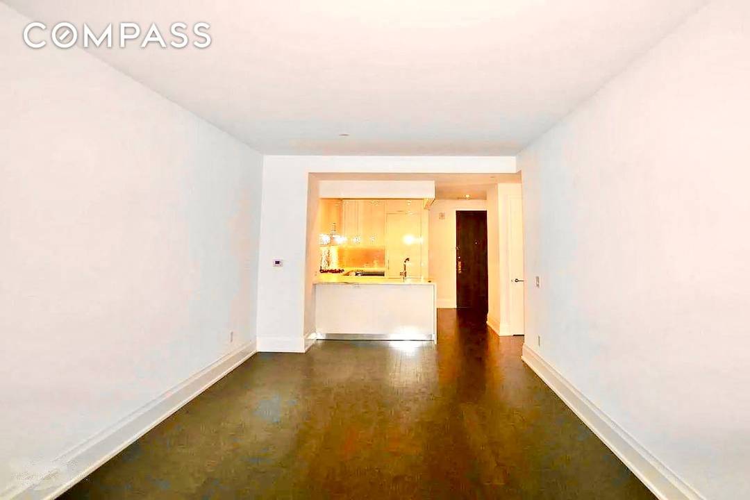 This 856 square foot, one bedroom, one bath residence offers beautiful southern exposure and warm, modern, elegant interiors by Shamir Shah Design.