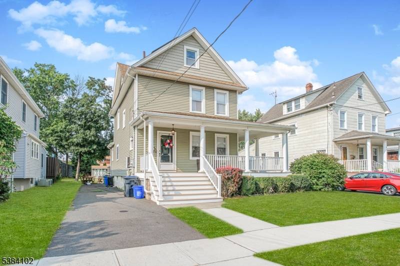Welcome home to this charming and updated 3 bedroom, 2 bath Colonial with wrap around front porch, open floor plan, and tremendous lot !