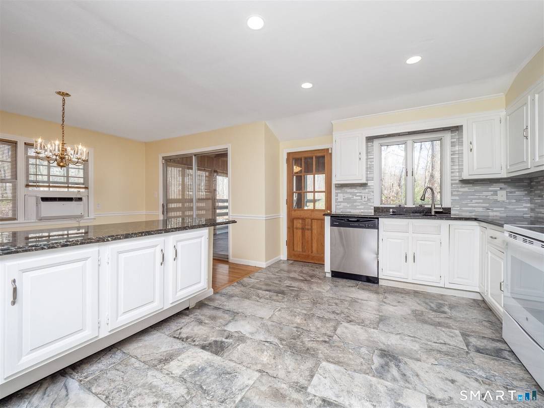 Lovely and spacious raised ranch in wonderful central Wilton location.