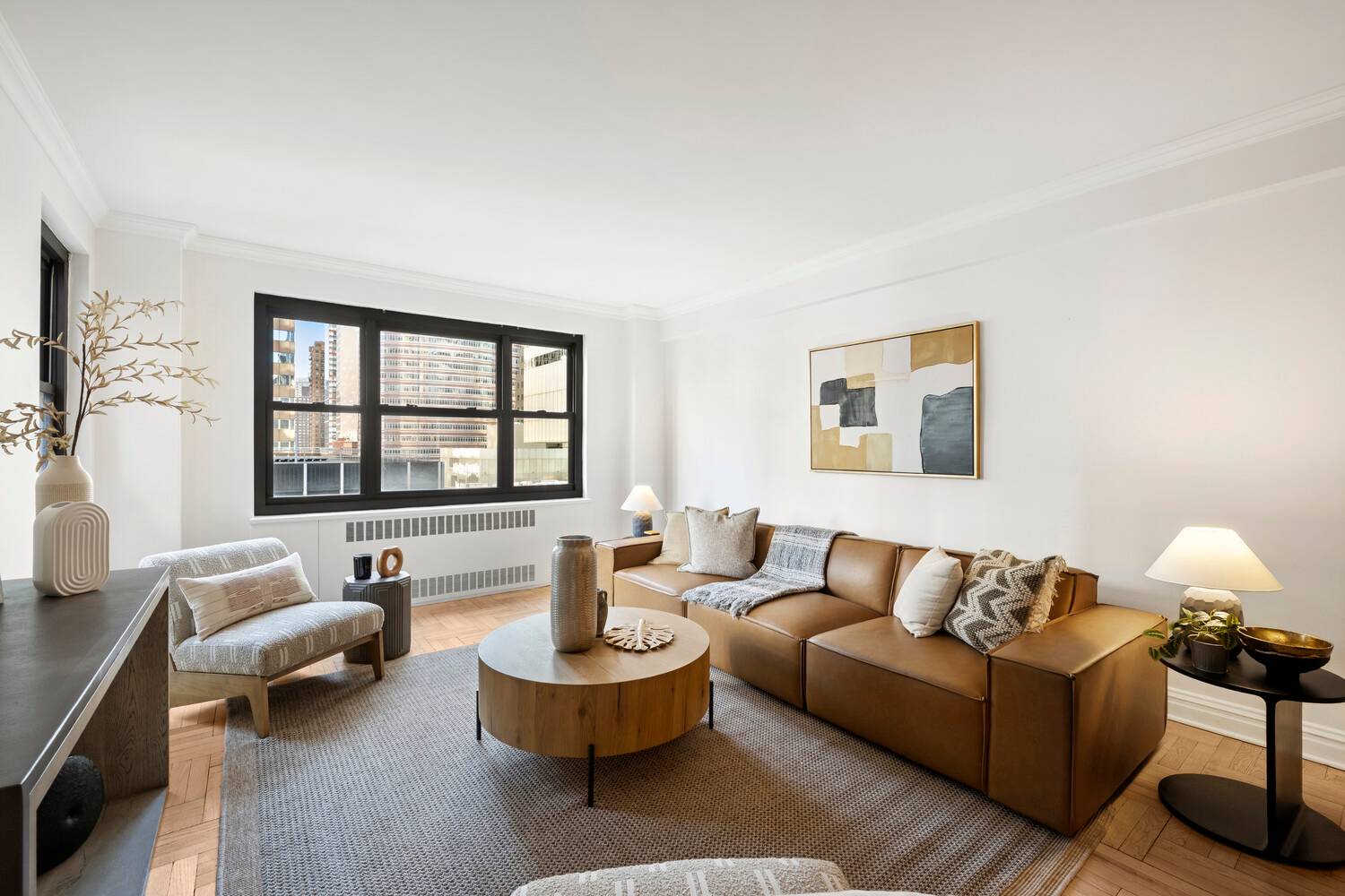 This centrally located high floor 2 bed 2 bath corner condo enjoys three exposures South, East and North and stunning views of the iconic Chrysler building !