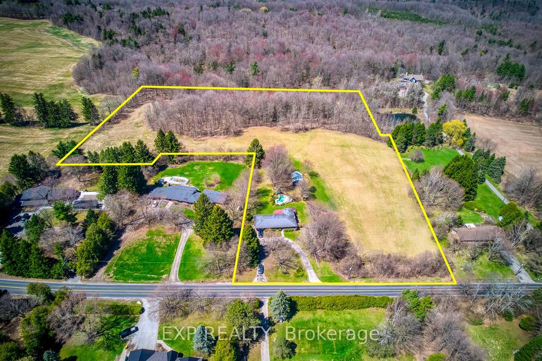 10 acre lot including a detached house for sale, just minutes from town.