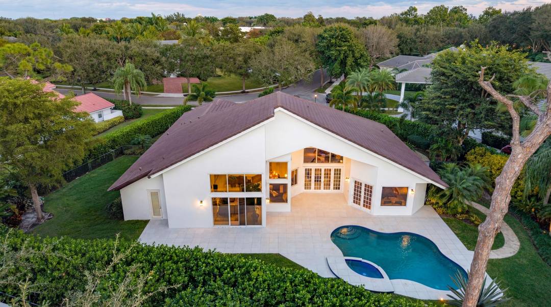 Sited amidst the lush splendor of Les Jardins, a prestigious gated enclave within 5 minutes of Pine Crest and St.