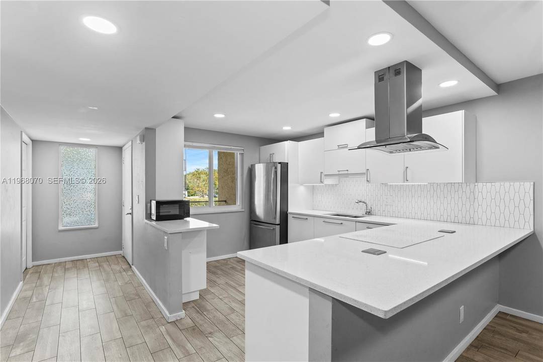 Completely REMODELED 2 bedroom 2 bathroom residence with a gorgeous LAKE VIEW in the highly desirable city of Weston.