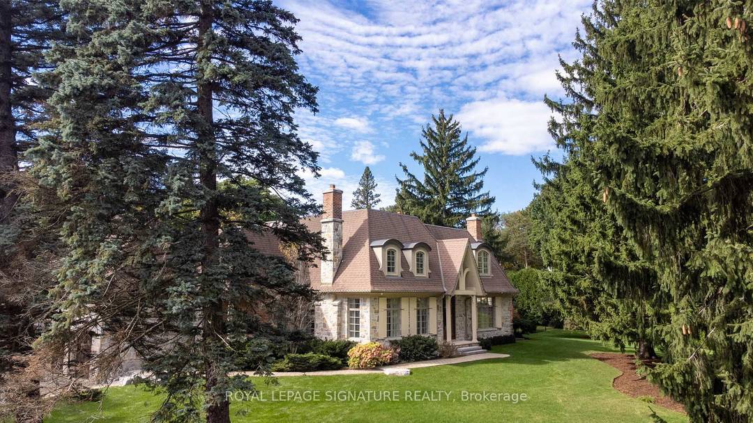 Immerse Yourself In Opulence With This Custom Built French Chateau Wrapped In Indiana Limestone On A Secluded Peninsula Lot.