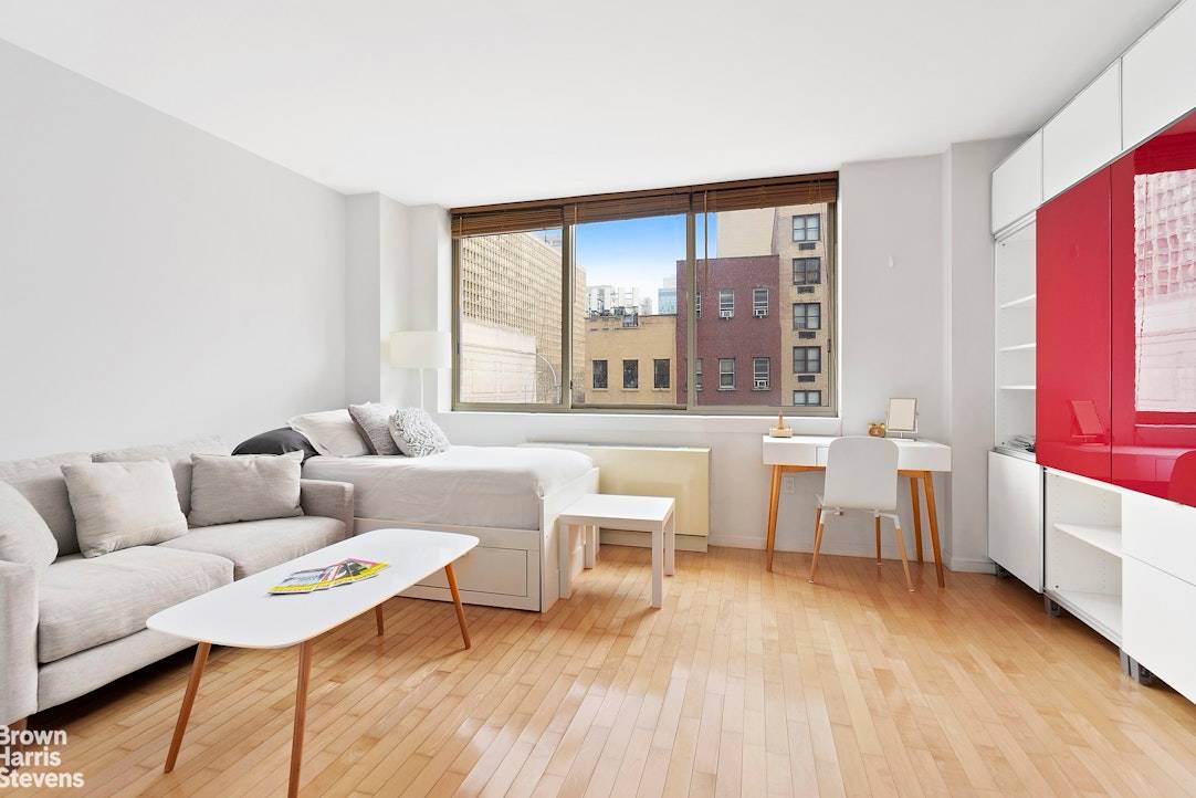 Loft like studio featuring 10 foot ceilings and oversized windows facing East with wonderful light and no wasted square footage in a luxurious full service condominium.