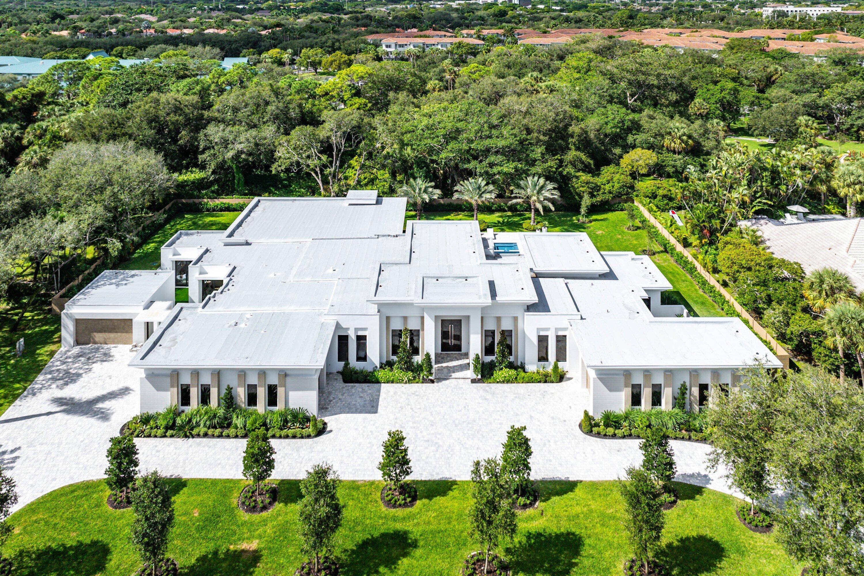This sprawling NEW CONSTRUCTION estate is situated on one acre within the prestigious gated community of Foxe Chase, offering 12, 500 square feet under roof with approximately 8, 000 square ...