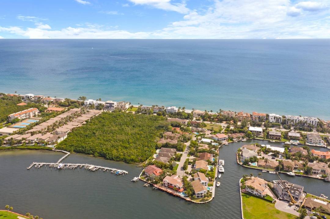 Magnificent walled and gated residence directly on Ocean Blvd with deeded beach access through a private locked gate.