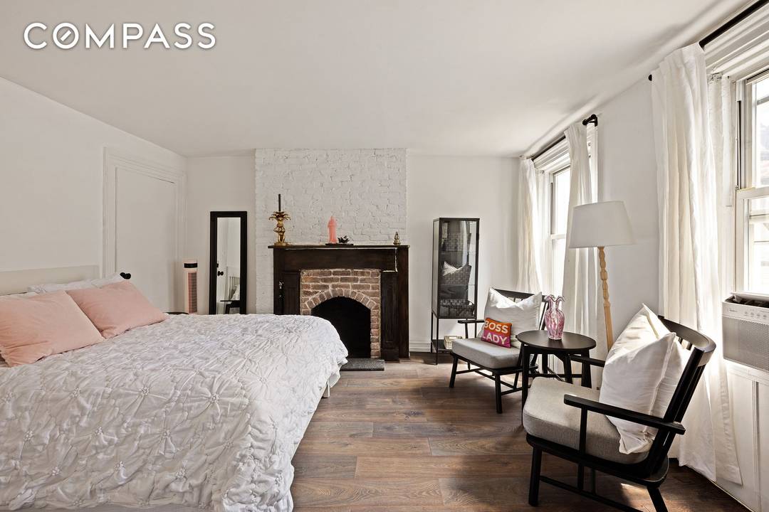 Tucked on a tree lined block of Perry Street, this charming pre war studio has all the romance a white brick fireplace, wide plank hardwood floors, an arched doorway, and ...