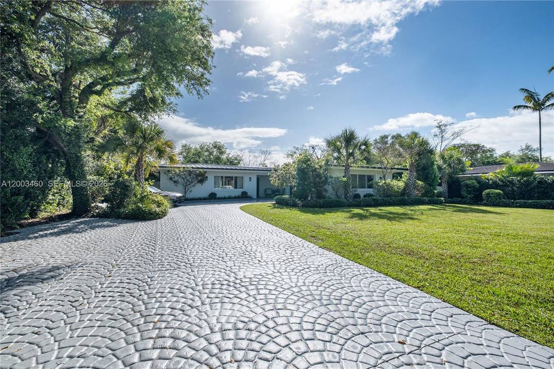 Beautifully updated 5 bedroom, 3 bath residence located at 10235 SW 58th Ct.